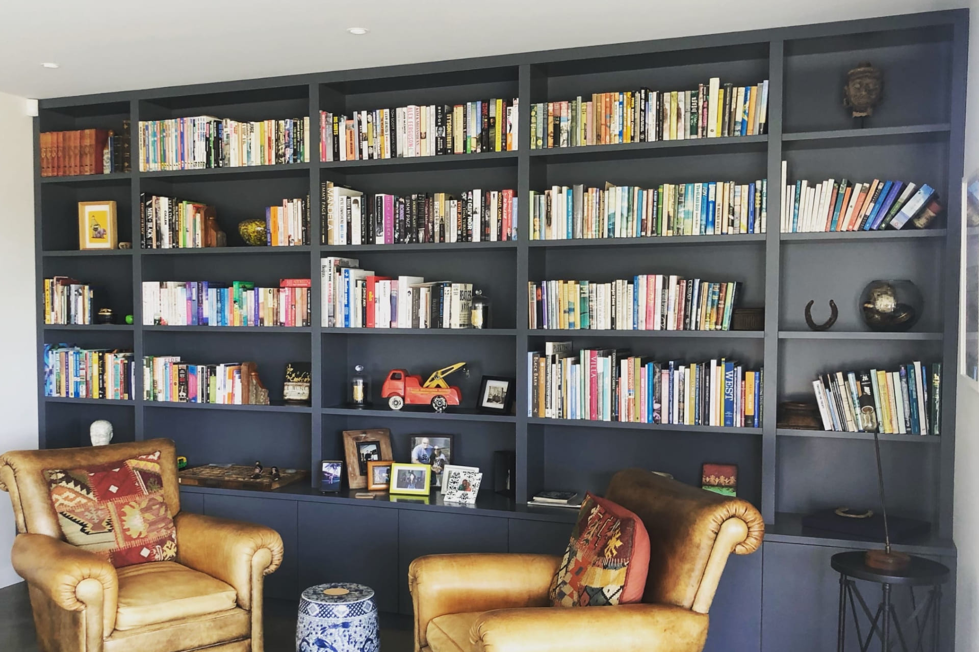 Image of cabinetry with two arm chairs